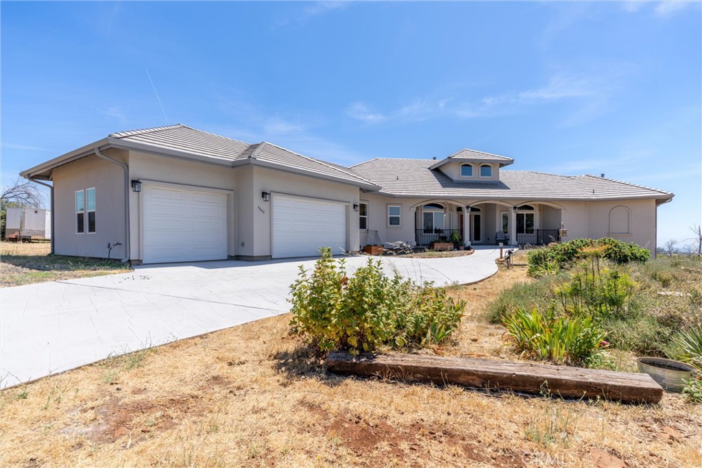 Stunning Custom View Estate on 20 Acres with Pool, Solar & More!
Welcome to your dream retreat just outside the charming town of Paradise! This nearly new, custom-built 2023 estate is a rare gem offering an incredible blend of elegance, space, and self-sufficiency — all set on a private, usable 20-acre parcel with panoramic views that stretch across the valley to the distant coastal mountains.
With 4 spacious bedrooms, a dedicated home office, and 3 bathrooms, this 3,001 sq ft home was thoughtfully designed to combine classic style with modern touches. Step inside and you’ll be greeted by a light-filled great room with soaring ceilings, a cozy fireplace, and a seamless flow into the stunning kitchen and dining areas. The kitchen is ideal for both everyday living and entertaining, boasting ample counter space, high-end finishes, and views that will inspire every meal.
Enjoy sunsets from the inviting covered front porch or bask in natural light from the exceptional sunroom, perfectly positioned to soak in the sweeping views. Just outside, you'll discover your own private oasis — a gorgeous in-ground pool with fencing around the pool and deck area for added safety and peace of mind.
This property offers features that go well beyond the ordinary, including:
• Owned solar system for energy efficiency
• 18KW backup generator for uninterrupted power
• Private well and well-house, providing reliable and independent water supply
• Culligan Water Softener and Reverse Osmosis Water System
• Oversized garage and a massive under-home storage area
• Private Primary Suite Balcony
• Durable concrete tile roof, beautiful tile work, and wood laminate flooring throughout
• Low maintenance stucco exterior and concrete walkways
• A large greenhouse structure, ready for your finishing touches
• Room for an ADU or Ample RV Parking
• Ample space and opportunity for horses, goats, or other livestock
Whether you’re dreaming of a private family compound, a hobby farm, or simply more room to breathe, this property delivers. All of this is conveniently located near the Paradise Airport, with an easy commute to Chico or Oroville, and close to Lake Oroville, hiking trails, kayaking, biking, and more.
This is truly a one-of-a-kind home that offers unmatched views, luxury living, and room to live the Northern California lifestyle to the fullest.
Don’t miss your chance to own this extraordinary Paradise property — schedule your private tour today!