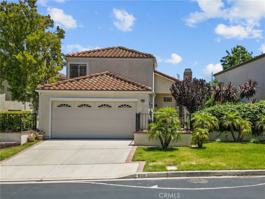 Welcome to 808 Links View Drive — a beautifully updated 2-bedroom, 2.5-bath single-family home in the highly desirable gated community of Wood Ranch in Simi Valley. Inside, you’ll find an open layout filled with natural light, an upgraded kitchen and bathrooms, and a versatile loft space that can serve as a 3rd bedroom, home office, or playroom — perfect for your lifestyle needs.
This two-story residence offers panoramic golf course views, access to a sparkling community pool, and a peaceful, resort-style setting.
The spacious backyard is a true retreat, featuring a mature lemon tree, a vibrant mix of colorful plants, a cozy fire pit, built in BBQ, and a large umbrella — perfect for relaxing or entertaining. Most of the potted plants will be included with the sale.
Additional highlights include epoxy floors in the garage, a Tesla charging station, and an upgraded electrical panel. Thoughtfully updated and move-in ready, this home offers beauty, flexibility, and an unbeatable location.