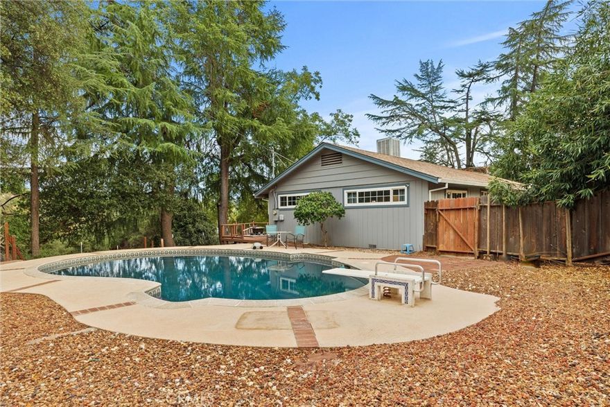 Beautiful Home with Acreage, Pool & Views in Oroville’s Foothills!

Welcome to this stunning property located on a fully fenced 1.24-acre lot in the highly desirable lower foothills of Oroville. This beautifully maintained home features an inviting inground pool and expansive backyard deck, perfect for entertaining, relaxing, and soaking in the breathtaking views.

The home offers a versatile bonus room downstairs with its own entrance and plenty of storage. This flexible space can easily be used as a craft room, home office, workshop, or even additional living quarters—tailored to your lifestyle needs. Outside, you’ll find a circular driveway with extra parking, plus plenty of space for your RV, boat, or other recreational toys. The property is thoughtfully landscaped, creating a serene and private setting while still being conveniently close to town. This home truly combines comfort, functionality, and outdoor living, all in one special location.