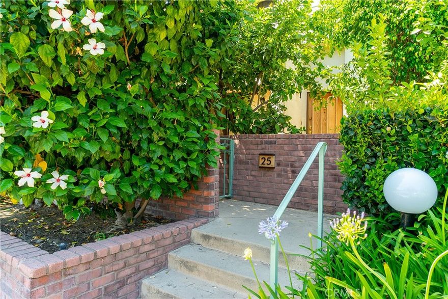 Welcome to your dream home in the resort-style community of Tarzana Courts!

This small, exclusive enclave of just 58 townhomes offers everything you need for a tranquil and secure lifestyle, including lush landscaping, a sparkling pool and spa, a clubhouse, and a tennis court.

This exquisite 3-bedroom, 2.5-bath townhome features 2,023 square feet of beautifully designed living space with soaring vaulted ceilings, skylights, recessed lighting, and elegant designer touches throughout.

Step into the spacious and inviting living room, where a grand fireplace sets the perfect ambiance for entertaining guests or enjoying a cozy evening at home. A stylish free-standing bar adds a touch of charm and convenience.

The chef’s kitchen is a true delight, complete with built-in appliances and a charming formal dining area ideal for hosting dinner parties or enjoying everyday meals.

The luxurious primary suite offers a private retreat with a walk-in closet, built-in storage, and a spa-like en-suite bath featuring a gorgeous double vanity. Step out onto your private balcony for a breath of fresh air.

Two additional generously sized bedrooms provide comfort and privacy for family or guests. The two-car attached garage includes a convenient laundry area and a small fitness space.

Enjoy the serene outdoor patio—perfect for al fresco dining or simply unwinding in your own peaceful oasis.

Located just minutes from the 101 Freeway and a short stroll to vibrant Ventura Blvd., you'll enjoy easy access to trendy cafes, boutique shopping, and fantastic dining.

Don't miss your chance to make this stunning townhome your own—schedule a tour today!