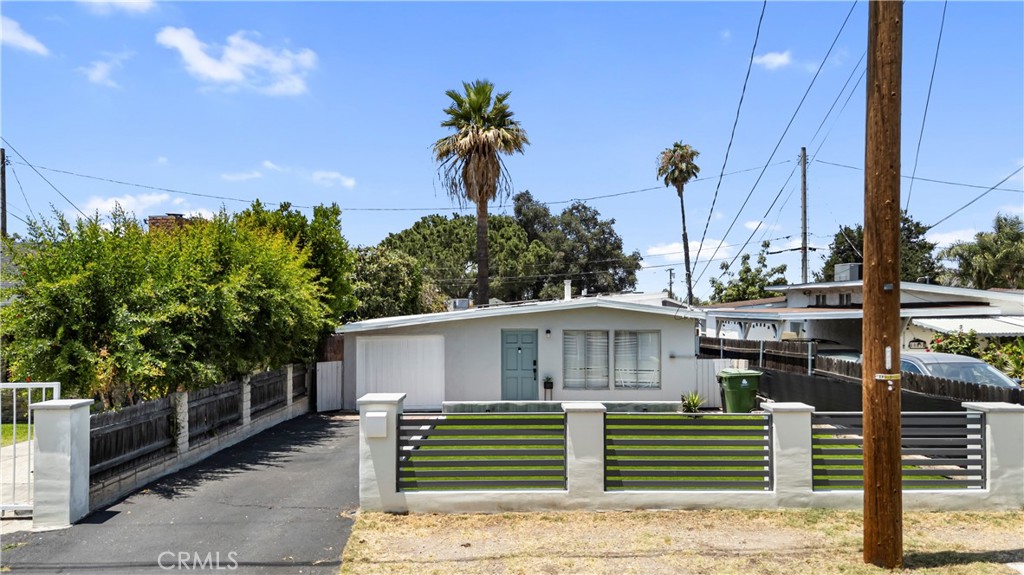 This charming 1948 midcentury modern home is nestled in the peaceful foothill community of Sunland and offers a perfect blend of classic character and everyday comfort. Step inside this well-kept 2-bedroom, 1-bathroom home featuring 844 sq ft of inviting living space. From the moment you arrive, the beautifully landscaped front yard sets the tone with its curb appeal and generous size. Inside, you'll love the warmth of original wood ceilings and the natural light that fills each room. The living area flows effortlessly into a cozy dining space, with French doors that open to the outdoors—perfect for indoor-outdoor living. The updated bathroom blends modern touches with timeless style, while both bedrooms offer just the right amount of space and comfort. Need a little extra room? The attached 1-car garage has been converted into a flexible bonus space—ideal as a third bedroom, home office, or creative studio. Out back, the spacious yard is an entertainer’s dream. Picture evening gatherings under twinkling lights, weekend BBQs, or simply relaxing while soaking in the sunset. There’s also plenty of room to expand if you're looking to grow into the space. Outdoor lovers will appreciate the home’s proximity to local hiking trails and natural escapes—just minutes from your doorstep.