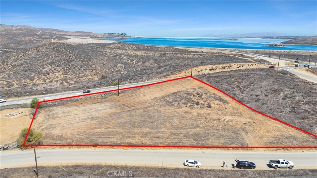 Prime corner lot at La Sierra & Cajalco near Lake Mathews! This flat, usable parcel with private road frontage offers scenic lake views, rolling hill vistas, and breathtaking sunsets. An ideal canvas for your dream estate, equestrian retreat, vineyard, or investment development (buyer to verify). The generous size allows for endless possibilities—build a main residence with an ADU, design a horse property, or enjoy wide-open land for recreation and privacy. Here you’ll enjoy the peace of a rural setting, yet still be just minutes from South Corona’s top-rated schools, golf courses, restaurants, and shopping. Corona hosts renowned shopping centers such as Dos Lagos and The Crossings. Quick freeway access connects you to the 15 and 91 for easy commuting, with retail hubs like Tyler Mall, Costco, and La Sierra dining corridors nearby. The property combines natural beauty with unbeatable convenience—perfect for those who want the best of both worlds. Rarely does a property with this much potential, visibility, and location come on the market. Whether you’re seeking a private lifestyle or an investment in one of Riverside County’s fastest-growing areas, this lot delivers a truly unique opportunity. (the red boundary lines are provided for estimation purposes of the boundaries. These lines are not perfect nor guaranteed to be the property lines.. provided for illustration purposes only)