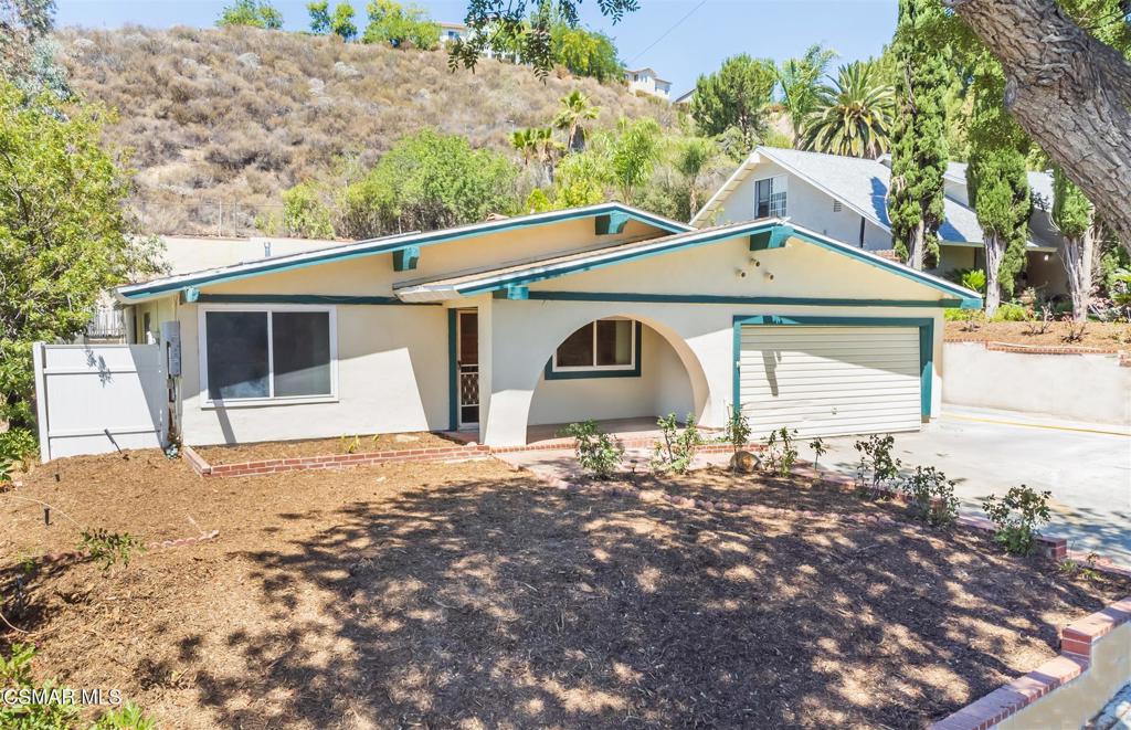 Wonderful 4-Bedroom Pool Home on a Spacious, Private Lot! Step into comfort and potential with this charming 4 bedroom, 2 bath pool home nestled on a generous, private lot. Inside, you'll find a freshly painted interior, stylish wood laminate flooring, and vaulted ceilings that add an open, airy feel to both the large living room and family room--perfect for relaxing or entertaining. The bright kitchen features crisp white cabinetry, classic tile countertops, and sleek stainless steel oven and black appliances, including a double-door refrigerator. The hall bathroom has been updated with a brand new shower-over-tub combo, while the primary bedroom offers its own en-suite bath with a stall shower and single-sink vanity. Outside, enjoy the expansive patio area and sparkling pool with spa--ideal for summer gatherings. Energy efficient leased Solar panels, stucco retaining walls enhance both the side and rear yard, offering a clean, modern touch. This home is move-in ready and waiting for your personal touch to make it truly your own. Don't miss this incredible opportunity to own a well-maintained pool home with space, privacy, and potential! Close to schools, shopping, restaurants, parks and much more. Stop by today!