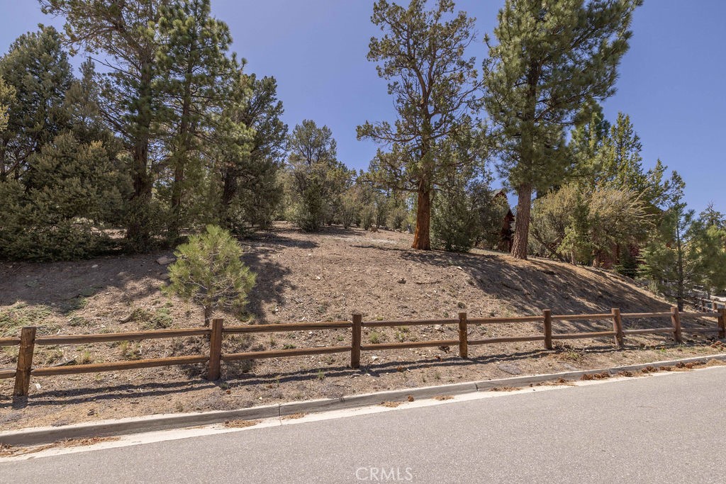 Located in one of the most sought-after neighborhoods in all Big Bear Lake, this Eagle Mountain Estates lot won’t disappoint. Start building right away on this 13,552 sq ft well treed lot with ski slope views in a private setting that backs to Eagle Preserve (Conservatory) on a small cul-de-sac. The forest is behind you that will never be built upon for privacy. Plans included for 4-bedroom, 3-bath home, including 2 master suites, and 2 south facing bedrooms capture ski slope views. Underground utilities. Multiple access roads to avoid traffic, nestled in forest but close to all attractions: 2.7 mi. to Bear Mountain Resort & Golf Course, 3.1 mi to Boat Docks, and 3.3 mi. to the Downtown Village for Shopping/Dining/Entertainment.