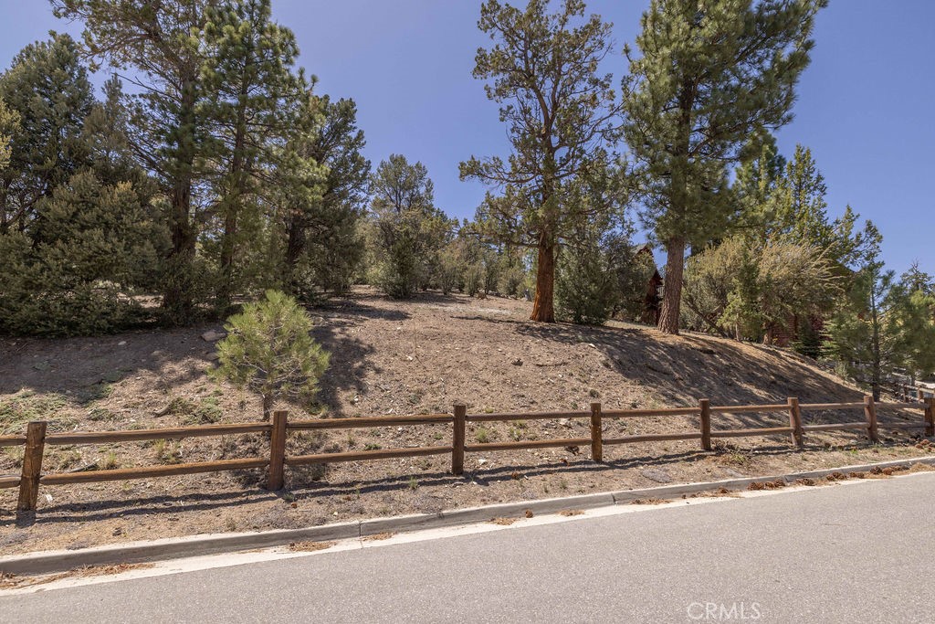 Located in one of the most sought-after neighborhoods in all Big Bear Lake, this Eagle Mountain Estates lot won’t disappoint. Start building right away on this 13,552 sq ft well treed lot with ski slope views in a private setting that backs to Eagle Preserve (Conservatory) on a small cul-de-sac. The forest is behind you that will never be built upon for privacy. Plans included for 4-bedroom, 3-bath home, including 2 master suites, and 2 south facing bedrooms capture ski slope views. Underground utilities. Multiple access roads to avoid traffic, nestled in forest but close to all attractions: 2.7 mi. to Bear Mountain Resort & Golf Course, 3.1 mi to Boat Docks, and 3.3 mi. to the Downtown Village for Shopping/Dining/Entertainment.