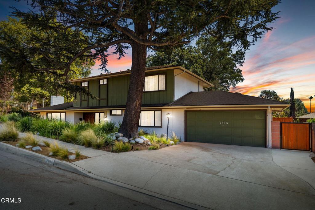 The first time on the market since 1999! This beautiful mid-century home is perched gracefully on a spacious corner lot with mountain views in beautiful Altadena. The Tillman's created an abundance of sweet memories in this home. The spacious open floor plan is ideal for entertaining with an abundance of natural light flowing in from the panoramic windows throughout the home. The sliding glass doors in the living room and dining room open to a relaxing retreat that includes a covered patio facing a beautifully landscaped back yard with gorgeous mountain views in the background. This relaxing outdoor space is perfect for dining al fresco with plenty of room for guests to enjoy. The spacious living room has mid-century vibes with a natural river rock wall that encompasses a warm and cozy fireplace, setting the mood for a good read with tea or quiet time for reflecting. Other cherished character details include pocket doors and terrazzo tiles throughout the first level plus the floating stairs with medal spindles that lead to the three bedrooms and two bathrooms upstairs. The upstairs bedrooms also offer panoramic views of the backyard, neighborhood and mountains while allowing plenty of natural light to pour into each room. The fourth bedroom downstairs is adjacent to a half bathroom and that room can also be utilized as a quaint family room or office space. This desirable home includes a new electrical panel, new condenser unit, new attic ducts and new paint. Otherwise, it's a blank canvas ready for the next owner to make their desired upgrades and create loving memories for years to come. The new owner will be in walking distance to the renowned Altadena Library, the popular Girl Scouts Campground and the infamous Christmas Tree Lane. The history in Altadena is rich and the future is bright! There are a few neighbors nearby beginning new construction on empty lots and in a matter of time the entire community will eventually be fully restored with beautiful new residences and quaint retail shops and eateries. Horses will be trotting around the neighborhoods once again and people will hike to Echo Mountain, Inspiration Point, Henninger Flats and all the other hiking destinations here in Altadena, CA. The best is yet to come!