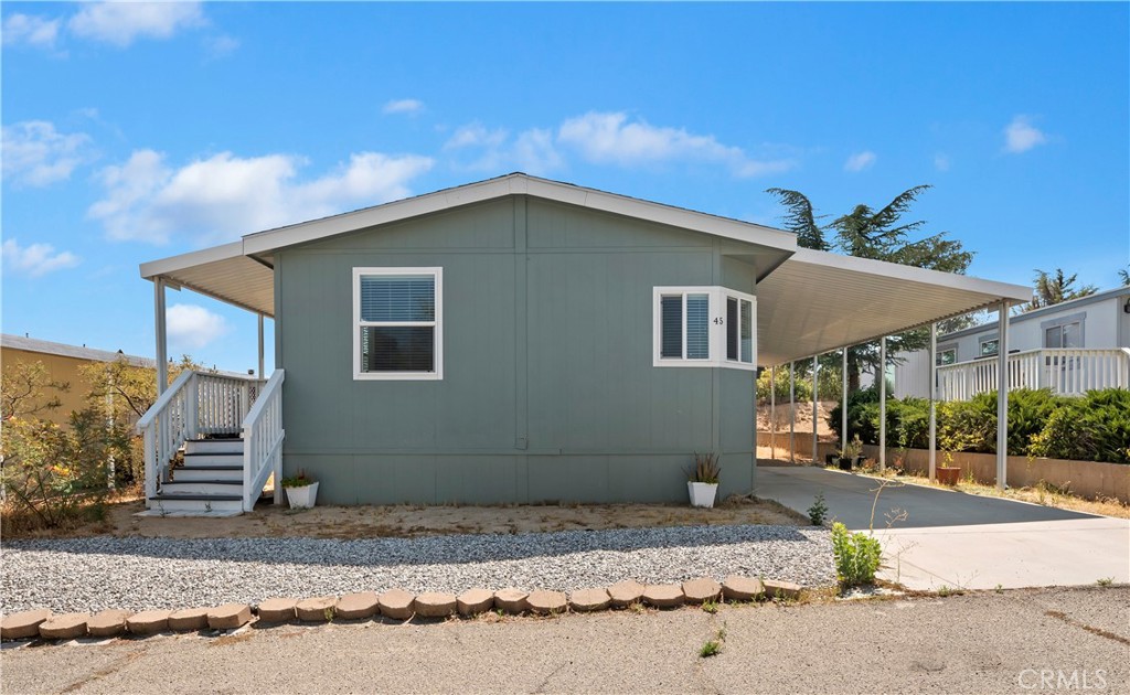 Welcome to this beautifully maintained 3 bedroom, 2 bathroom home located in Anza Pines, a peaceful, all-age community nestled in the scenic mountains of Anza, CA. Built in 2022, this home has is in immaculate condition and ready for you to move in and enjoy. Inside, you’ll find a bright and open floor plan with neutral tones, wood laminate flooring throughout, and thoughtful built-in storage. The kitchen and living areas offer a seamless flow, perfect for both relaxing and entertaining. Relish the convenience of a brand-new washer and dryer, no water charges, and low space rent. Situated in a quiet park setting, this home offers a rare combination of modern living and natural tranquility. Whether you're taking in the peaceful surroundings or exploring nearby attractions like Temecula Wine Country or Lake Hemet, you’ll love calling Anza Pines home.