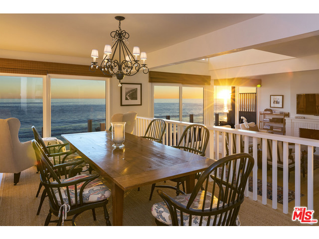 Quintessential California beach house on sandy La Costa Beach, completely remodeled with designer quality features. This is what every beach buyer wants in a Malibu oceanfront home. Immaculate, light and bright with new wood floors and windows; shows like brand new. Gated entry with lovely garden courtyard with fountain and potted plants, plus two enclosed car garages. Open kitchen features Subzero and Viking appliances with large breakfast bar and oceanfront dining area off living room with fireplace, leading to an oceanfront deck overlooking the sand. Romantic master suite with oceanfront balcony, plus two additional bedrooms upstairs, one facing the water. Gated with security alarm system and laundry inside. Convenient location, close to town. Come experience this exquisite beach home.