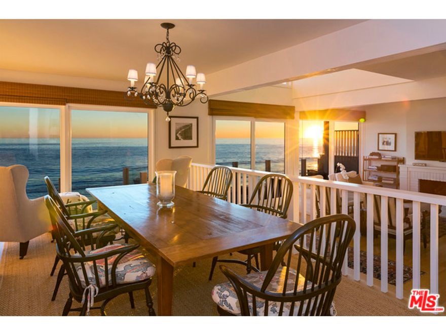 Quintessential California beach house on sandy La Costa Beach, completely remodeled with designer quality features. This is what every beach buyer wants in a Malibu oceanfront home. Immaculate, light and bright with new wood floors and windows; shows like brand new. Gated entry with lovely garden courtyard with fountain and potted plants, plus two enclosed car garages. Open kitchen features Subzero and Viking appliances with large breakfast bar and oceanfront dining area off living room with fireplace, leading to an oceanfront deck overlooking the sand. Romantic master suite with oceanfront balcony, plus two additional bedrooms upstairs, one facing the water. Gated with security alarm system and laundry inside. Convenient location, close to town. Come experience this exquisite beach home.