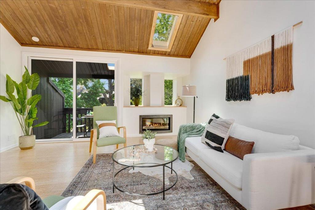 Immaculate and sunny, this fully renovated condo is the perfect turnkey beach home, just bring your flip flops! Thoughtfully upgraded from top to bottom with all-new energy-efficient systems, double-paned windows, and sliding glass doors, this home blends modern design that's both comfortable and low maintenance! Upstairs, an expansive living and dining area is filled with natural light, featuring vaulted ceilings, four skylights, a warm gas fireplace, and a stylish half-bath. The spacious chefs kitchen includes a walk-in pantry, custom walnut cabinetry, marble countertops, and stainless steel appliances, ideal for everyday cooking or entertaining. Downstairs, bamboo floors with in-floor radiant heating run through both bedrooms. The primary suite opens to a private patio and a large shared lawn. The bathroom includes a generous walk-in shower, the hallway offers both a laundry closet with washer/dryer and a large under-stair storage closet. A secure outdoor shed adds storage for bikes and beach gear. Located in the quiet, well-maintained Shelter Lagoon community with green space, a heated pool, tennis/pickleball courts, and boardwalk access to Neary Lagoon, West Cliff Drive, and the beach. Plenty of on-site parking, and a designated covered carport with additional storage.