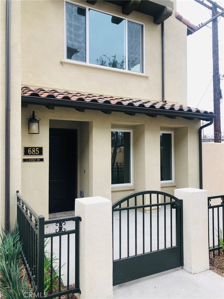 Newer Construction in the heart of Anaheim. This beautiful end unit, 3 story home WITH LOTS OF WINDOWS features 3 bedrooms, 3 1/2 baths, Central heating and A/C, inside laundry room, stainless steel appliances, granite kitchen counters, small balcony off of the dining area, master bedroom features a walk-in closet, 2 car attached garage, One bedroom and bathroom downstairs, Wood like Luxury Vinyl planks throughout the house. Don't miss out on this GEM!!!