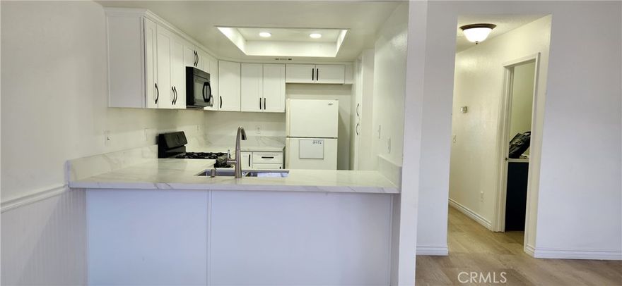 The owner just finished renovation of the entire condo.  list of upgrades includes brand new vinyl flooring in the entire condo, brand new cabinets, brand new quartz countertop, brand new vanity with quartz countertop, new baseboards, new paint in entire of the condo, brand new faucets and sinks. also, less than 18 months new washer and dryer, dish washer, microwave, garbage disposal and new heating system.  Ready to move in upstairs corner unit with large balcony, very private with only one sharing wall, no one living below or above the unit. The  condo has two large bedrooms and it's conveniently located near schools, park, grocery market, restaurants, and the lake of course. Commute friendly near both 74 and 15 freeways. Very open and airy feeling with generous living space and oversized kitchen and lots of cabinets and counters. The unit also features a large dining area that leads to the spacious living room and a large balcony with views. This condo sits on top of it's own one car garage, and also has one assigned parking space.