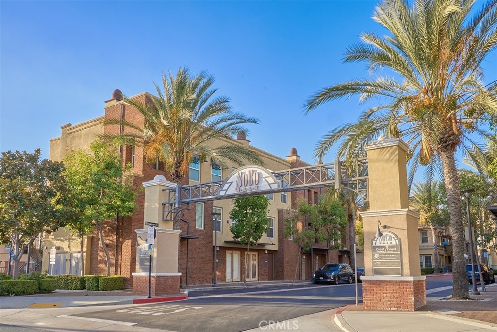 Spacious 3 Bedroom, 3 Bathroom townhome in the desirable SOCO Walk community, located in the heart of Downtown Fullerton. Entry level offers direct access to a two-car garage. The main level features an open-concept living, dining, and kitchen area, plus one bedroom and a full bathroom. Walnut-colored flooring, a gas fireplace, and a balcony add comfort and style. The kitchen includes white cabinetry with glass-front accents, granite countertops, and recessed lighting. Recent upgrades include BRAND NEW interior paint and BRAND NEW carpet on stairs and in all bedrooms. The upper level offers two master suites with high ceilings, private bathrooms, and generous closet space. A convenient indoor laundry closet is located upstairs. SOCO Walk offers an urban lifestyle within close proximity to the Fullerton Amtrak and Metrolink stations, restaurants, coffee shops, and entertainment.