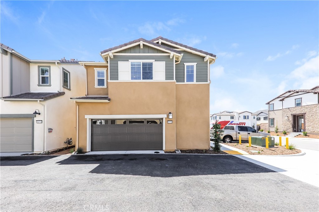 This home is professionally managed by Tricon Residential, dedicated to creating exceptional rental experiences. Featuring three bedrooms, two and one half bathrooms, and approximately 1,524 square feet, this well-maintained home offers a high standard of rental living, supported by a team that puts residents first. Tricon Menifee is a secure gated rental community nestled between San Diego and Orange County. Enjoy virtually maintenance-free living with the conveniences of smart home technology including automatic thermostat control and keyless front door entry. Every home offers open concept designs including stainless steel appliances, quartz countertops, two-car attached garages, and in-home washer and dryer. Enjoy well-maintained community amenities including a lap pool and spa, sundeck with ample seating, dog park, tot lot/playground, fire pit, BBQ area, fitness center and clubhouse.