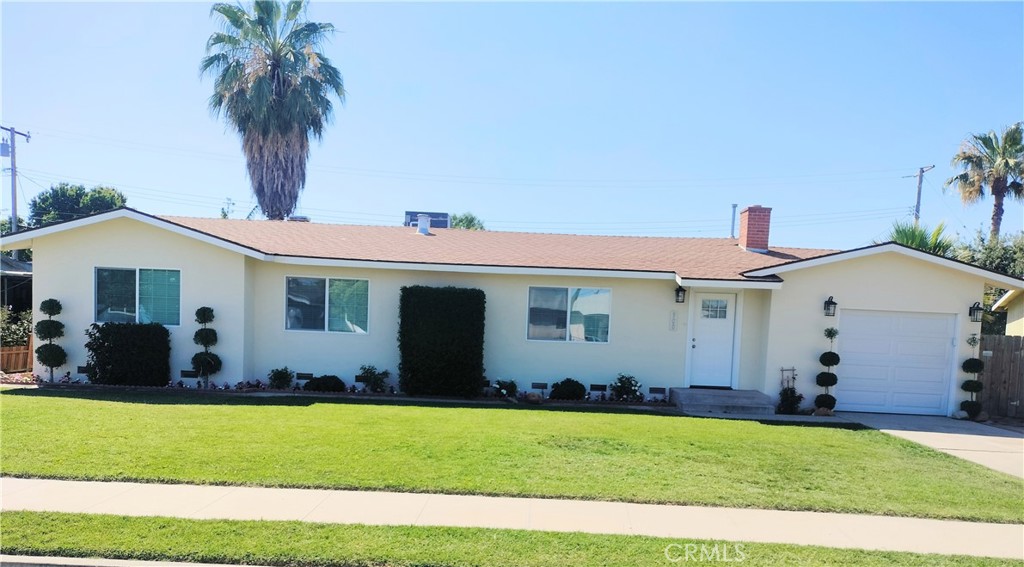 Beautifully Remodeled Mid-Century Ranch Style Home! Offering 3 bedrooms, 2 bathrooms, beautiful kitchen and a large backyard. The Kitchen offers new wood kitchen cabinets, granite countertops, mosaic backsplash and stainless steel appliances. Large format Italian porcelain floor tile continues throughout the living room, dining room, kitchen, hallways, bathrooms and laundry. This home additionally offers New Windows throughout, New Carpet in the bedrooms, New French Doors in the kitchen leading out the large backyard and a Drive thru garage with new insulated garage doors adds to the many amenities this house offers. The oversized lot and large backyard gives you the ability to build an ADU or shop and still have plenty of space to create your own oasis. (renderings available upon request(check with city for requirements) Perfect for a first time home buyer or as an investment property. Call and schedule your tour today!