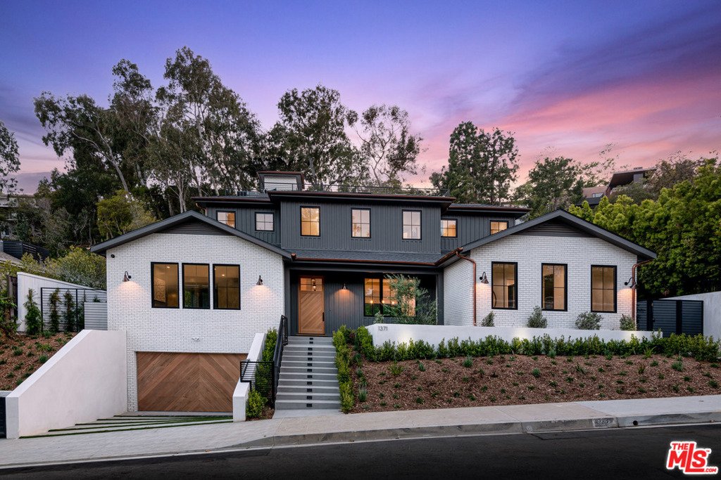 Enjoy the ultimate in Southern California living in this brand-new construction Modern Farmhouse, built by Shelter Homes! Ideally located near Palisades Village, yet with privacy and an oversized lot (13,000+ sq ft), this 6 bedroom and 9 bath home is everything you have been looking for and more. Exceptionally designed with every detail in mind, you will find stunning finishes and custom fixtures throughout. The main floor features a gourmet kitchen and breakfast area, living room with private patio, dining room and family room, walk-in pantry, butlers pantry, laundry & 1 en-suite bedroom that open out to the large yard. The yard is expansive & perfect for entertaining with a large pool and spa, tons of grass, BBQ, fire pit, and an outdoor lounge and dining area. Upstairs you will find 4 en-suite bedrooms including the master suite with 2 walk-in closets, a fireplace, and a balcony. This home features entertaining areas abound, from the sprawling backyard to the rooftop deck (with elevator access) where you can enjoy the ocean view or a starry night sky and a lower basement level with movie theatre, gym, wine cellar, mudroom, powder bath with steam shower and 1 additional en-suite bedroom. 1371 Marinette strikes the perfect balance between private oasis and convenience. A true one-of-a-kind, can't miss property in the best location in the Palisades