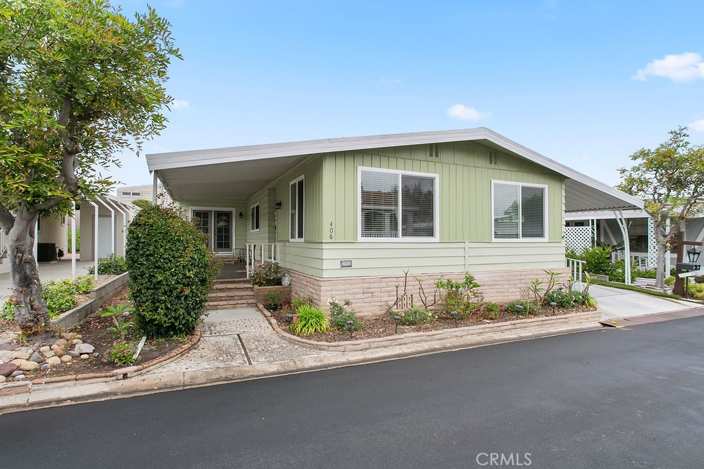 Welcome to your new home in the serene 55+community of Forest Gardens! This 1768 sq foot mobile home offers 3 bedrooms and 2 baths. The large floor plan is ideal for family, guests or roommates and the separation of the bedrooms is great! The very large master suite has a large walk-in closet and the master bath has a large custom walk-in shower with dual sinks, off the large front porch you will enter through the glass doors into a great family room, then a nice dining area. The kitchen has Quartz countertops and a farm sink. Custom cabinets with soft close drawers, and stainless steel appliances. Then onto a nice sized laundry room, the separate living room is a great space with two additional bedrooms, a well appointed second bath with a walk in/set down tub. The home also has solar tube lights, ceiling fans, and a warm colored laminate flooring throughout the home along with dual pane windows. The large cement driveway has extensions and a custom ramp! a very large storage shed and artificial turf, as well as a gardening area. Great community amenities such as a large remodeled ballroom, clubhouse, and a swimming pool. Small ponds throughout the community including scenic walking paths and lots of community social events.