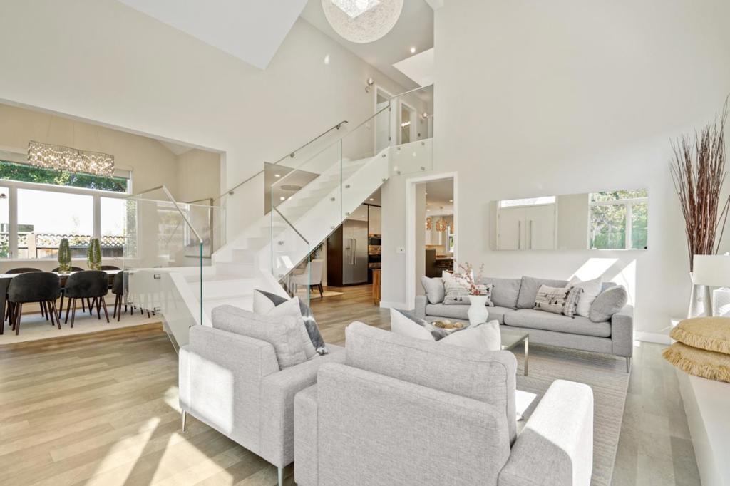 Located in the esteemed Old Palo Alto community, this fresh and modern home was fully renovated in 2018. Walking through the open courtyard and into the front door, you enter into a wide and airy living room with vaulted ceilings that showcase a magnificent glass enclosed staircase. A fully featured kitchen with stone countertops, has a large center island, Thermador and Wolf appliances, and ample cabinetry. The basement is fully furnished, featuring 2 bedrooms, a large multipurpose area suitable for play or for entertaining, and also its own food preparation area. This smart home features Nest Thermostats, Ring cameras and Bay Alarm for 24/7 Security. The backyard displays an island with a BBQ cooktop and sink. The solar panels(owned) will account for 90% of power usage(from installer). Two EV charging plugs are useable in both the garage and courtyard. Many more upgrades not listed above. Minutes to Palo Alto High, Stanford Campus, University Ave, with EZ access to Hwys 101 and 280.