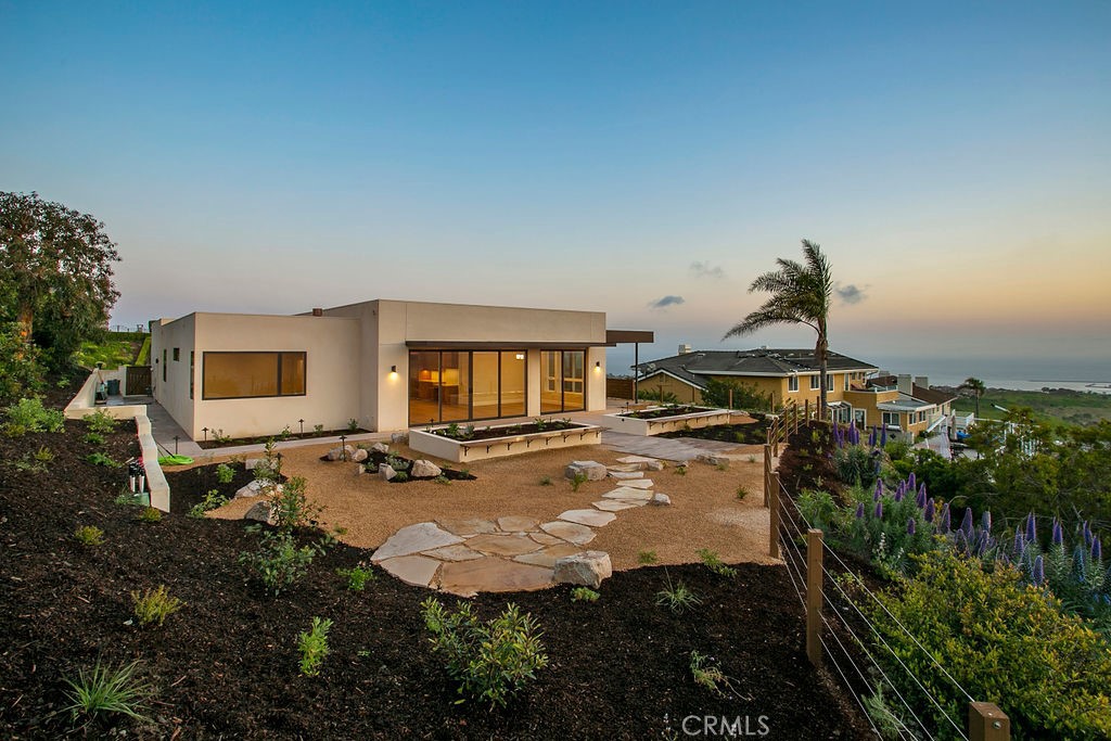 Available September 9th! Built in 2023, this luxurious 4 bedroom, 3.5 bathroom home, located in the Meredith Canyon neighborhood of San Juan Capistrano, boasts unparalleled views of the surrounding hills, valley below, and the ocean including Catalina and Dana Point Harbor. Make this rare single level home your own! Step into the stunning modern entryway complete with high ceilings which leads seamlessly into the spacious living area. The open floor plan features large glass sliding doors and windows that showcase breathtaking views, while allowing natural light to flood in and highlight the sleek finishes and contemporary design. A magnificent blue tile fireplace is centered in the living area. The gourmet kitchen is open to the living and dining areas and is a chef's dream. Equipped with state-of-the-art stainless-steel appliances including a Subzero refrigerator, elegant quartzite countertops, ample cabinet space, and walk-in pantry. The primary suite is a serene oasis, complete with a spa-like ensuite bathroom and a private covered patio area. The ensuite features a beautiful tile walk-in shower, double sink vanity, separate water closet, and a large walk-in closet with built-ins. At the front of the home is a large floorplan suite with amazing views, private ensuite with gorgeous tile shower, and a walk-in closet. This room is ultra-versatile and could be used as an office, gym, den, or a wonderful guest suite! The two additional bedrooms have generous closet space and access to a stylishly appointed separate bathroom between. Additional features of this impressive property include a guest powder room located at the front of the home adjacent to an inside laundry room, storage closets, linen cabinets throughout, and a 2-car garage with epoxied flooring. Enjoy the ultimate California lifestyle with an expansive outdoor living area that backs up to city open space. The patios, benches, and flagstone path are perfect spots for lounging and dining. The landscaping features California-native plants, enjoyed by local birds, butterflies, and wildlife. The home is also located just steps from San Juan Capistrano’s Patriot Trail, with access to miles of hiking and biking trails. The historic cities of San Juan Capistrano, San Clemente, and the Dana Point Harbor are nearby with many shops, restaurants, and entertainment options. Come experience the epitome of luxury living in this stunning home!