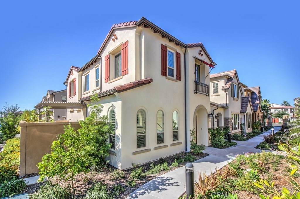 TWILIGHT OPEN HOUSE Sunday, July 27th 5-7 PM. Tucked inside the exclusive gated community of Camden Square, this beautifully maintained detached home offers the perfect blend of comfort, functionality, and location. With 3 spacious bedrooms, a versatile upstairs loft, 2 full bathrooms, a main-level powder room, and a 2-car attached garage with direct access and solar panels, this residence is thoughtfully designed for modern living.
Step inside to discover an open-concept layout that seamlessly connects the expansive Great Room and kitchen, creating a warm and inviting space for everyday living or entertaining. The gourmet kitchen boasts an oversized center island with breakfast bar seating, sleek granite countertops, stainless steel appliances, and ample cabinetry—ideal for the home chef. Plantation shutters and overhead lighting add a polished touch throughout.
Upstairs, the loft offers flexible use as a home office, media room, or play space. The primary suite includes a walk-in closet and an en-suite bathroom with dual vanities and a large walk-in shower. Two additional bedrooms and a full bathroom provide plenty of space for family or guests.
Enjoy outdoor living in your private, low-maintenance patio complete with a mature fig tree—perfect for morning coffee or evening gatherings. Additional highlights include a tankless water heater, energy-saving solar system, and end-unit privacy.
Camden Square offers resort-style amenities including a sparkling pool and spa, BBQ area, outdoor fireplace, and a tot lot. Ideally located just minutes from Foothill Ranch Towne Center and Foothill Ranch Market Place, you'll have easy access to popular dining spots, retail shops, grocery stores, fitness centers, healthcare facilities, parks, hiking trails, and the public library.
Don't miss your opportunity to own a home in one of Foothill Ranch’s most desirable communities!