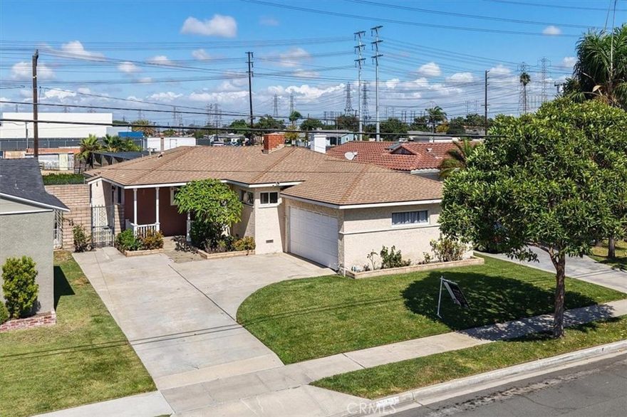Welcome to 3615 W 187th St! This beautifully maintained 3-bed, 2-bath home offers 1,551 sq. ft. of living space with a light and airy flow throughout. The bright kitchen features white cabinetry, granite countertops, stainless steel appliances, a modern hood range, ample storage, and a breakfast bar that opens directly to the dining area with a cozy fireplace and elegant crown molding. From there, the space flows naturally into the spacious living room, which offers plush carpet for comfort, while wood flooring runs throughout the rest of the home. Sliding glass doors lead to a private backyard with no rear neighbors, complete with a concrete patio and fixed awning—perfect for relaxing or entertaining. Down the hall are three spacious bedrooms and one full bath, while the second bath is conveniently located off the living room and kitchen. Ideally situated in Northwest Torrance near Columbia Park, Torrance Unified schools, and shopping. Don't miss the opportunity to make this charming home yours!