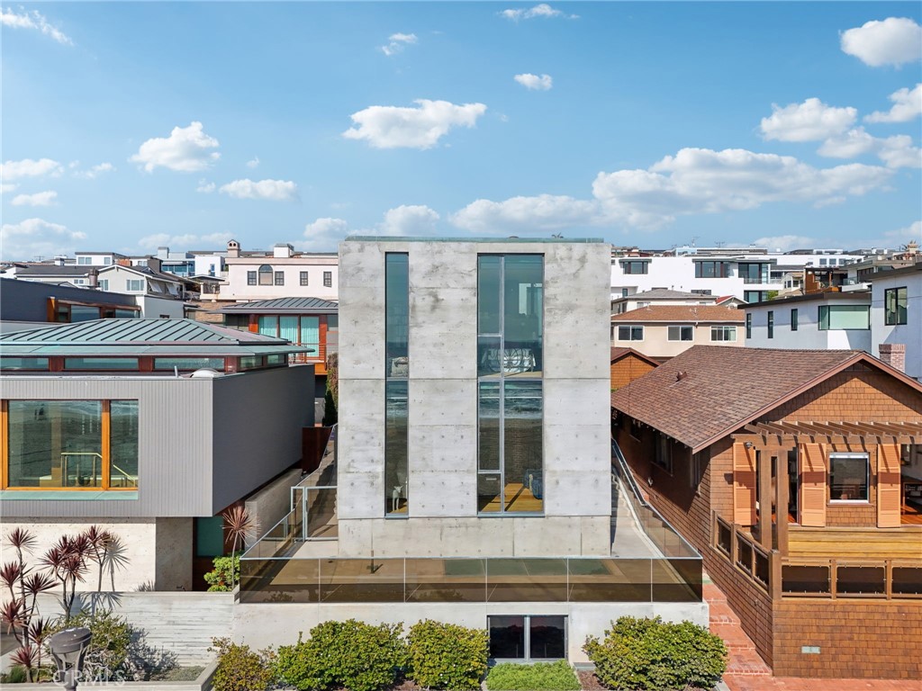 Art, architecture, and opportunity converge on one of the most sought-after stretches of The Strand. Built in 2006, this bold 2-bedroom, 2.5-bath, ~3,500 sq ft residence offers a rare glimpse into a design philosophy few would dare attempt today — a nod to Brutalist architecture, where form follows emotion, and every detail is built to last.
Originally commissioned by a couple with a world-class art collection, the home was thoughtfully designed as a private gallery space — with soaring volumes, concrete construction (rumored to be engineered to withstand hurricanes and tsunamis), and a powerful, minimalist aesthetic that’s as rare as the location itself. While the art has moved on, the canvas remains, offering endless possibilities: reimagine, refresh, or start anew.
And here's where it gets even more exciting: the property directly to the south is also available, creating the exceedingly rare potential for a side-by-side acquisition. Buyers are encouraged to verify with the City of Manhattan Beach for future plans — but if approved, this could become one of the most extraordinary double-lot opportunities ever to come to market on The Strand.
Location is everything — and this address delivers: perched on an elevated section above the bike path, with sweeping views from Malibu to the Manhattan Beach Pier, and just a few short blocks to the heart of downtown Manhattan Beach’s celebrated dining, shopping, and beach lifestyle.
Whether you're an architecture enthusiast drawn to its artistic soul, or a visionary ready to create a new Strand legacy, this is a once-in-a-generation offering that demands attention.