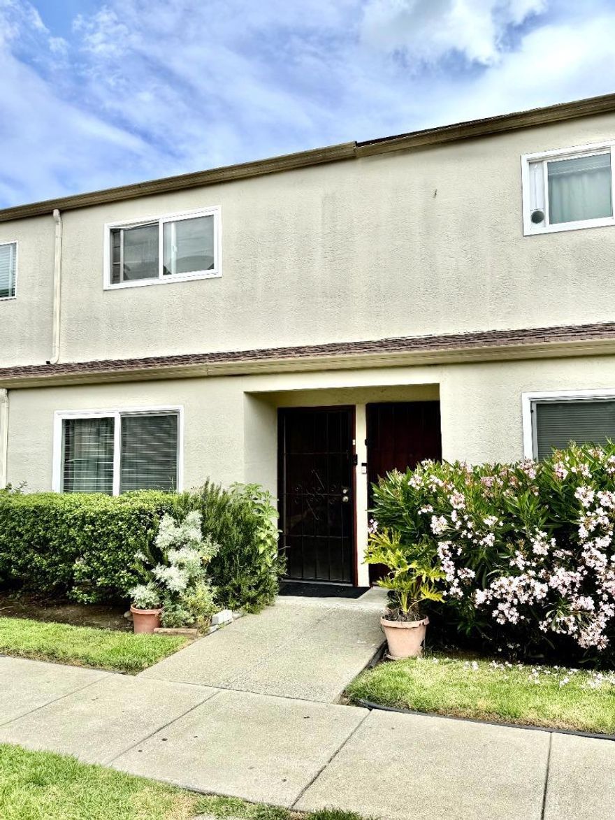 Welcome to this charming 2-bedroom, 1.5-bathroom Townhouse located in the vibrant city of Hayward. Spanning 882 square feet, this home offers a cozy living space with a dining area perfect for intimate meals. The kitchen is efficiently designed, making meal preparation a breeze.   This property comes with access to a community pool, offering a great place to relax and unwind. There is a carport and one extra open parking, the community amenities and central location provide convenience and comfort.  This residence is situated within the Hayward Unified School District, providing educational options for families. With no cooling system and a unique heating setup, this home offers a distinct living experience in a dynamic community.