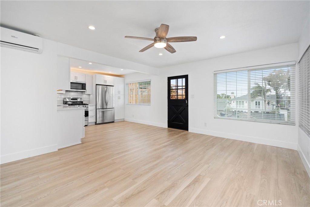 Welcome to this beautifully remodeled 2-bedroom, 1-bathroom back unit, ideally located in the heart of Corona Del Mar. Perfectly situated on a corner lot, this private residence is just a short stroll from world-class beaches, renowned restaurants, and charming boutiques. Inside, the unit has undergone significant upgrades, creating a stylish and comfortable living space.
Step into a fully remodeled kitchen featuring modern finishes, seamlessly connected to a bright and airy living area enhanced by new flooring, recessed lighting, and ceiling fans in every room. The updated bathroom showcases new fixtures and sleek tile work, while both bedrooms offer spacious closets with new doors, providing generous storage. Throughout the apartment, brand-new dual-pane windows offer energy efficiency and sound insulation, complemented by a new heating and air conditioning system to ensure year-round comfort.
The interior and exterior has been freshly repainted, and a whole-house water filter and softener system has been installed for added convenience. The unit also includes an in-unit washer and dryer, as well as a secure outdoor storage space and a dedicated area for bikes. No parking included, however, plenty of street parking is available on one of Corona Del Mar's quietest flower streets.