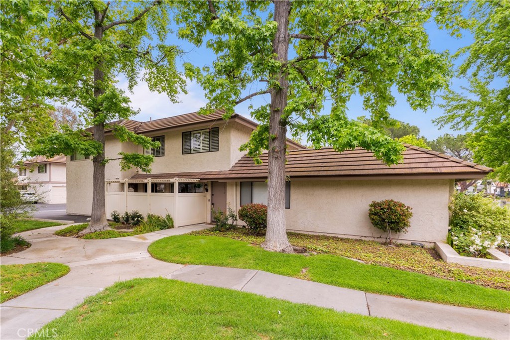 Location! Location! Location! Tucked in the heart of Westlake Village walking distance from the lake, this beautifully updated end-unit in the perfectly located Village Green community offers the perfect blend of comfort, convenience, and charm. Enjoy close proximity to vibrant shopping, dining, the local farmer's market (every sunday morning across the street), scenic greenbelts, and serene Westlake Lake—a true lifestyle location. Inside, you'll find two inviting bedrooms and an updated bath, complemented by a open floorplan living room and a refreshed kitchen featuring a brand new oversized sink, stainless steel oven, and garbage disposal. New wood laminate flooring flows throughout the main level while plush newer carpet adds warmth upstairs. Freshly painted with plantation shutters, recessed lighting, and a newly installed AC/heater system, the home is move-in ready. Two large sliding doors open to your own private patio, perfect for morning coffee or relaxing evenings. Additional highlights include in unit laundry hookups, a one-car semi-attached garage with extra storage shelving, an adjacent dedicated parking space, and access to HOA amenities including pools, spas, basketball court, lush greenbelts, a community laundromat, and included water and trash services. Unit is electric only so the only utilities tenant really needs to pay are electric and cable/internet. Call for details!