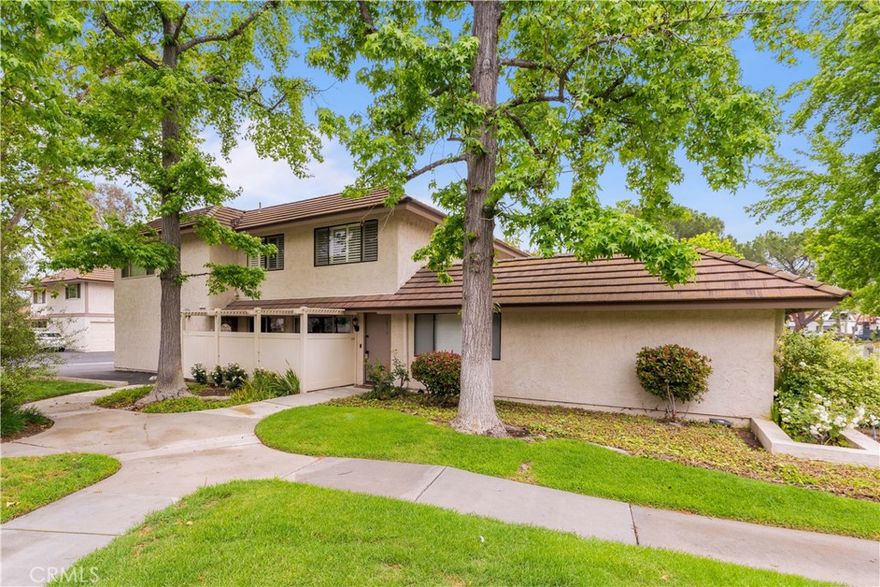 Location! Location! Location! Tucked in the heart of Westlake Village walking distance from the lake, this beautifully updated end-unit in the perfectly located Village Green community offers the perfect blend of comfort, convenience, and charm. Enjoy close proximity to vibrant shopping, dining, the local farmer's market (every sunday morning across the street), scenic greenbelts, and serene Westlake Lake—a true lifestyle location. Inside, you'll find two inviting bedrooms and an updated bath, complemented by a open floorplan living room and a refreshed kitchen featuring a brand new oversized sink, stainless steel oven, and garbage disposal. New wood laminate flooring flows throughout the main level while plush newer carpet adds warmth upstairs. Freshly painted with plantation shutters, recessed lighting, and a newly installed AC/heater system, the home is move-in ready. Two large sliding doors open to your own private patio, perfect for morning coffee or relaxing evenings. Additional highlights include in unit laundry hookups, a one-car semi-attached garage with extra storage shelving, an adjacent dedicated parking space, and access to HOA amenities including pools, spas, basketball court, lush greenbelts, a community laundromat, and included water and trash services. Unit is electric only  so the only utilities tenant really needs to pay are electric and cable/internet. Call for details!