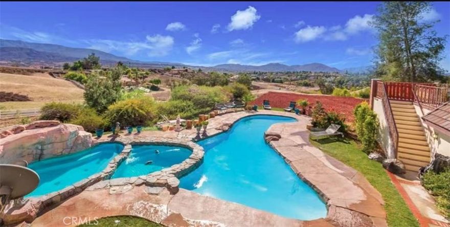 Escape the hustle of city life and embrace the poetic paradise of Southern California’s wine country! Nestled in the heart of Temecula’s renowned Wine Country within the exclusive Country Road Estates community,offering breathtaking panoramic valley views that redefine upscale living. This is more than just a property—it’s a dream fortress tailored for equestrian enthusiasts, aviation aficionados, and nature lovers alike. Expansive Barn and Pastures for Multiple Horses.Whether you’re a professional rider or a casual enthusiast, these professionally designed equestrian facilities ensure safety and comfort—truly a rare gem in Southern California!One-of-a-Kind Private Airstrip: Sky-High Convenience at Your Doorstep.As a rare treasure in the Country Road Estates community, this estate provides direct access to the private community landing airstrip.This “fly-in, live-in” setup is exceptionally rare in the Southern California real estate market, offering the ultimate private sanctuary for aviation enthusiasts! Stunning Views and Elegant French Tudor Architecture,The main residence embodies classic French Tudor style with romantic arched doorways,three large fengshui-inspired ponds designed to attract prosperity and good fortune. Backyard Oasis: a three-tiered rock pool with cascading waterfall and oversize Jacuzzi, overlooking panoramic mountain ranges and valley sunsets. The large front and back Koi ponds, once home to vibrant fish, now serve as serene landscape elements infusing an Eastern fengshui charm. Perfect Blend of Wine Country Charm and Modern Convenience ositioned at the gateway to Wine Country, the estate is just steps away from numerous acclaimed wineries—enjoy world-class tastings and explore Temecula’s vast vineyards with a short walk or drive. Right next door, a spectacular hot air balloon scenic field allows you to watch colorful balloons dance across the sky from your own balcony at dawn or dusk, like a living dreamscape! Everyday conveniences are equally impressive: award-winning schools, shopping centers, Starbucks, and grocery stores,Crown Hill Park,sports park are only 5 minutes away, Experience rural tranquility without sacrificing urban accessibility.

Whether you’re an equestrian devotee, a pilot, or a wine country recluse, this is your exclusive kingdom. Bring your horses and aircraft to Temecula—your wine, equestrian, and aviation dreams begin here. Schedule a private tour today and discover this Southern California marvel!