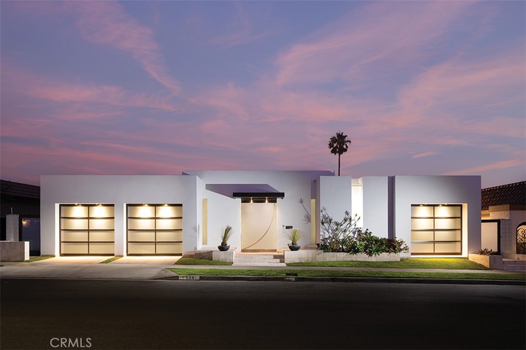 Poised above the prestigious bluff of Dover Shores with extraordinary views of Newport’s Back Bay and the Pacific coastline, 1336 Galaxy Drive is a masterwork of architecture and artistry. Originally designed in 1963 by renowned Los Angeles architect Harold Levitt for Virginia Knott Bender, this estate has been reimagined into a Mediterranean Modern sanctuary, blending open-plan design with coastal resort living.
Spanning nearly 5,000 square feet, this residence includes a statement-making 6’ x 9’ glass entry door with offset pivot hardware that opens up to a private courtyard which enhances privacy while connecting the spaces to a fully integrated smart home that elevates the experience of indoor-outdoor living. The second gateway controlled by a pair of 14’ high Herculite® double glass doors opens into a pool atrium space with open-concept living areas featuring floor-to-ceiling retractable glass doors, a retractable translucent roof, custom-cut travertine flooring, and a design aesthetic that reflects California's contemporary style, evoking serenity and inspiration. The four en-suite bedrooms — three of which open directly to the pool atrium — are generous in size and accentuated by high 9’ plate ceilings, while the primary suite offers a private sanctuary with direct views of the Back Bay. The primary suite features a gas fireplace, a luxurious bath with refined finishes, and a bespoke walk-in wardrobe. Additional highlights include a stylish home office, a versatile room that can serve as a bedroom or gym, a full laundry suite, and expansive outdoor spaces designed for entertaining.
The chef’s kitchen is a celebration of function and form, featuring top-tier Thermador, Dacor, Asko, and Gaggenau appliances, including a built-in steamer and teppanyaki stations. The kitchen flows seamlessly into the pool atrium, offering effortless indoor-outdoor entertaining beneath the ever-changing sky.
Outdoor spaces invite both contemplation and celebration, featuring a Back Bay-view fire lounge, LED-lit bocce court, al fresco dining terrace, surf shower with board storage, EV charger, and a dedicated gear/storage garage.
Crafted with passion over five visionary renovation phases (2010–2025), 1336 Galaxy Drive is more than a home—it is an experience shaped by its stunning views, architecture, setting, and breathtaking design.