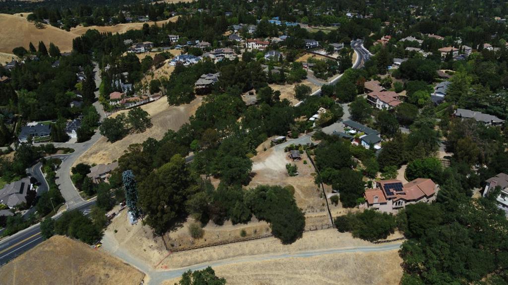 Build your dream home!! 1.523 acres with preliminary plans for a custom home sits at the top of the knoll boasts sweeping vistas up and down the San Ramon Valley, the Las Trampas peak and filtered views of the grand Mt. Diablo. Featuring a rustic automated iron privacy gate with stone pillars, Fire Dept. turn around and a water infiltration pond. 2 wells, a new pump, provides water for the many mature fruit trees and decorative Olives were planted on the property along with Redwoods, Crepe Myrtles, Apples, Persimmons, and table grapes. Full 6' high perimeter fence with automated entry gate, Engineered driveway and turnaround, Access to Utilities on Livorna Rd, which is the northern boundary of the property. Close to the town of Alamo and Walnut Creek, Easy access to Broadway shopping center in Walnut Creek. Local open space and hiking tails; Sugar Loaf and Las Trampas; Briones Regional Park is a short drive away. Iron Horse hiking and biking trails.