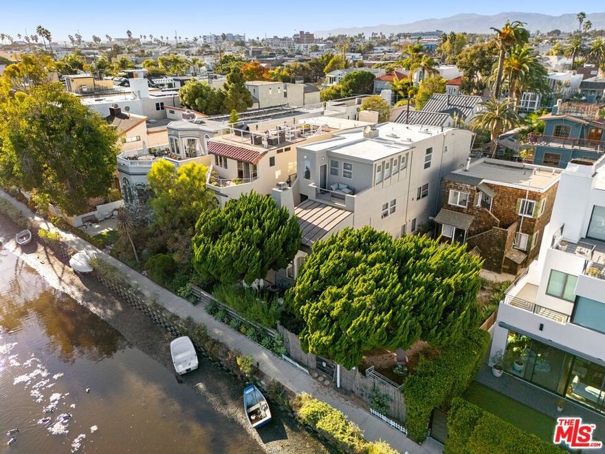 Welcome to the coveted Venice Canals, developed in 1905 by the visionary Abbot Kinney. This unique community offers a rare sense of serenity amidst the vibrant energy of Venice. 427 Sherman Canal presents a charming opportunity to live this lifestyle in a quaint, south-facing two-story vintage house, with a classic exterior staircase. The kitchen features natural wood countertops, a stainless steel double sink, and crisp white cabinets. An abundance of windows take full advantage of the southern light exposure while also framing views of the genuine yard, a rare find in the canals. The mature California Juniper tree at the yard's edge shades outdoor lounging and seating, creating a unique and balanced setting for a low-maintenance, indoor-outdoor canal lifestyle. This is a rare property that prioritizes a tranquil yard over a maxed-out lot. It's surrounded by new and updated $4-$5m homes, with a future opportunity for development. We'd love to show it to you.
