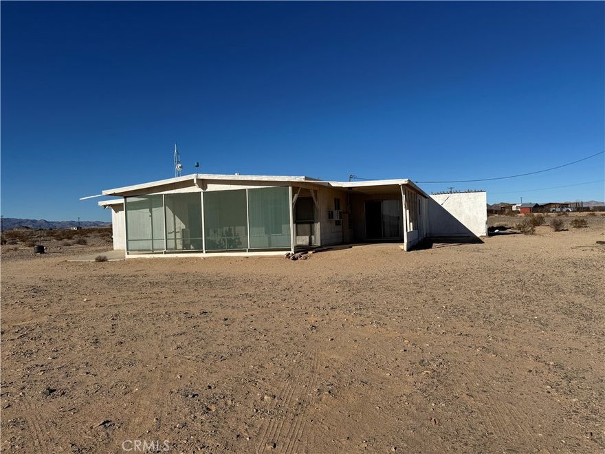 Mojave Desert Views! See the mountains as the sun rises and sets turn red, orange and purple as the sun moves East to West. This two bedroom, one bathroom property does need some attention but is solid and ready for your vision. Take a moment to find a sanctuary that can calm the soul of the troubles that follow us in the 21st century. Set on five glorious acres in the charming community of Wonder Valley, this property is calling you. 15 minutes to the entrance of Joshua Tree National Park, the USMC Base or Downtown 29 Palms. 30 minutes to Downtown Joshua Tree. It could be a wonderful Airbnb or a perfect 2nd home far, far away from the insanity of the City. Now is the time. Come see something with great potential.