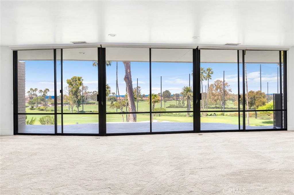 Overlooking the 9th tee of the exclusive Newport Beach Country Club, this beautifully maintained 2 bedroom plus den/office residence is tucked within the private, guard-gated enclave of Granville, which is home to just 68 residences. Located on the upper level, the home offers a quiet, serene setting with sweeping golf course views and a glimpse of the Pacific beyond.
The kitchen is tastefully designed with a center island cooktop and classic finishes, opening to spacious living and dining areas with soft carpet underfoot. The primary suite includes a separate soaking tub and walk in shower. Sliding glass doors lead to a covered balcony ideal for morning coffee or unwinding with sunset views over the fairways.
Additional highlights include in-home laundry, a private one-car garage, and a covered carport located just outside the home's entrance. Granville offers a 24 hour guarded entrance, a beautiful pool and spa, as well as a well-appointed clubhouse. Just a short stroll or golf cart ride to Fashion Island's world-class shopping, dining, and entertainment, this is Orange County living at its most refined. Available for Lis August 15, 2025 after balcony renovations are completed.