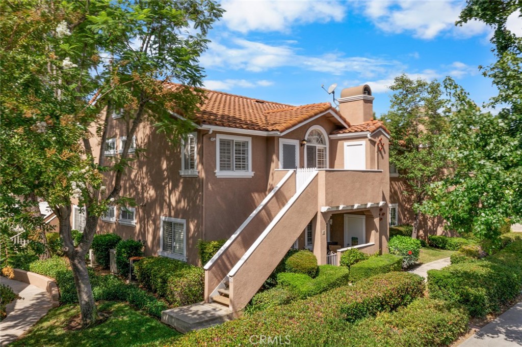 A great opportunity to own your own condo, one of the cleanest 2 bedroom and 2 bath with fantastic mountain views from the patio in this community. This home is completely refreshed with a remodeled kitchen, newer counters, newer sink, stainless appliances, vinyl flooring throughout, new recessed LED lighting and plantation shutters. In the bathroom you will find newer flooring, vanity with granite countertop, new sink, new mirror and lighting and a tub and shower. The master bedrooms feature sliding mirrored closet doors and closet organizers. The kitchen has a stainless French door refrigerator ,stone countertops and a vented microwave with contemporary recessed LED lighting. A stackable washer and dryer is included in unit. It is almost like a new home. No expense spared. Being a second-floor home, there is no one above you and the unit has higher ceilings and tons of light. All windows have plantation shutters, Large outdoor deck and storage closet on the patio. Home includes one covered carport and additional parking on the premises.Residents of Las Flores III enjoy private access to an on-site community pool, along with full membership to SAMLARC’s impressive array of amenities. These include the Beach Club & Lagoon, multiple swimming pools, sports courts for tennis, pickleball, and basketball, scenic walking and biking trails, beautifully maintained parks, shaded picnic areas, community clubhouses, outdoor amphitheater, and the fun-filled Central Park splash pad. Ideally located close to acclaimed schools, popular shopping centers, local dining spots, and easy access to the 241 Toll Road, this residence offers a lifestyle of ease and accessibility, set within a community known for its exceptional amenities and welcoming atmosphere.