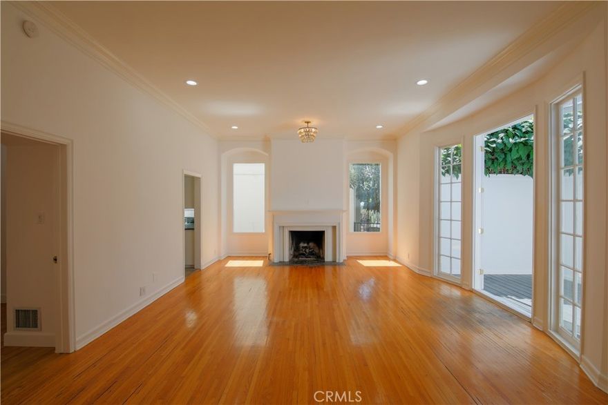 Regency House built in 1938, European elegance accented by preserved original details throughout - all complimented by access to a picturesque, internal courtyard with a seating area and fountain.  This Hollywood Regency-style ground floor, corner unit benefits from no shared walls and 2 separate entrances:a private, rear kitchen entry; and a main-entry door directly off the lobby. It has a private, in-unit laundry with full sized washer and dryer included; a gas burning fireplace in the living room; 12 foot high ceilings; 2 large balconies, one full bath and a second one-half bath located directly off the living room, with a wall hung toilet.  The large master bedroom has an attached private patio and a massive amount of closet space (needs to be seen to be believed), along with a full bathroom with double sinks, garden window and marble floors.   Replaced matching hardwood floors in the bedroom make for a seamless transition from the living room’s original, beautiful red-oak flooring.  An oversized chef’s kitchen includes an extra-large stainless steel range with two ovens; granite countertops; stainless steel fridge/freezer;dishwasher; and a French-paned door to the courtyard. Indoor outdoor living is exemplified by French doors leading from the living room to a private balcony.  Remote control for 2 living room window blinds.   It has its own private, fully enclosed garage with remote opener.  An amazing property that shows pride of ownership and attention to detail-a complete gem and piece of Hollywood history rarely on the market.