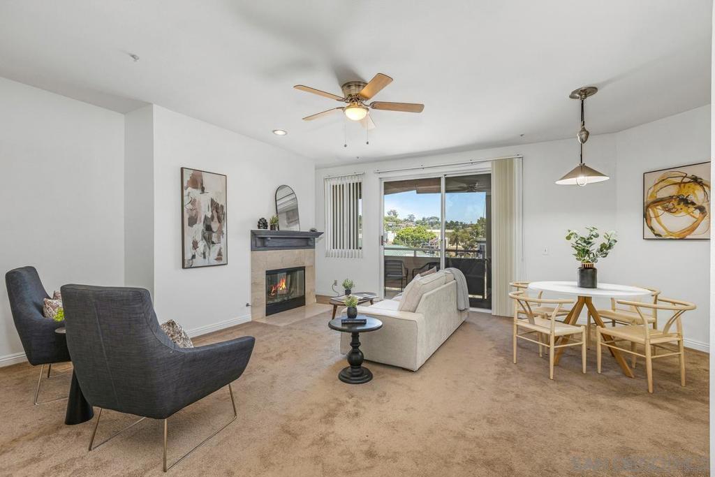 Welcome to your spacious retreat in the heart of La Mesa! This light-filled condo offers the perfect blend of comfort and convenience, all just steps from the Village. From your private patio, you can see the charming shops and restaurants that make this neighborhood so desirable — giving you that perfect balance of lively city energy and a cozy home retreat. Inside, you’ll find a thoughtfully designed floor plan with neutral paint tones, an inviting fireplace, and custom built-in bookshelves in the living room. The open kitchen flows seamlessly into the dining and living areas, while large windows fill the space with natural light. Enjoy in-unit laundry for everyday convenience. Grab coffee at Public Square, enjoy craft beer at Helix Brewing, or savor dinner at Farmer’s Table — all just steps from your door. Plus, with the Village farmers market and local shops nearby, you’ll love having everything you need right at your fingertips. Whether you’re enjoying quiet evenings by the fireplace or heading out for a night in the Village, this condo places you in the center of it all. Parking – 219 has one assigned space, also labeled #219. A second vehicle may be parked with permit in the double or triple lettered spaces. HOA Fee Includes: Water, sewer, trash, WIFI, Basic Cable
