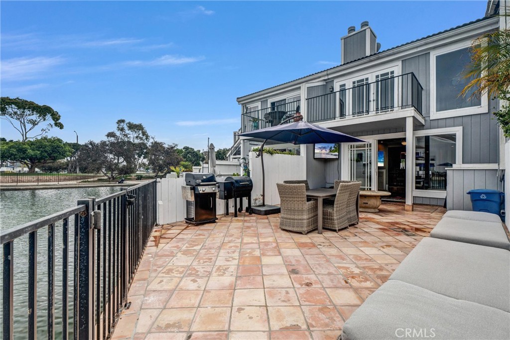 Waterfront Living at the Lowest Price in Seagate!
Dreaming of life on the water? Welcome to Seagate—Huntington Harbour’s premier private community—where this Davenport model townhome delivers the perfect blend of coastal charm and modern upgrades. Nestled on Trinidad Island, you’re steps from Huntington Harbour, Mother’s Beach, and Seabridge Park, with Bolsa Chica Wetlands and State Beach just a short bike ride away. Inside, this 3-bedroom, 2.5-bath residence offers a flexible floor plan with a convenient downstairs bedroom and powder bath, plus an enclosed front patio that opens to warm Spanish tile floors. A custom wrought-iron staircase leads upstairs, while the chef’s kitchen features granite counters, a 5-burner Verona range, LG refrigerator, GE wine fridge, Thermador dishwasher, KitchenAid trash compactor, and oversized farmhouse sink. Cook in style as the kitchen flows into the dining and living areas, complete with a cozy fireplace and direct access to your private waterfront patio. The upstairs primary suite is the crown jewel—showcasing vaulted ceilings, dual mirrored wardrobes, a remodeled ensuite bath, and serene water views from a private balcony. Across the hall, the spacious third bedroom offers a large walk-in closet with built-in LG washer and dryer. Recent updates include dual-pane windows, new carpet on the stairs, vinyl plank floors upstairs, recessed lighting, remodeled baths, and included
wall-mounted TVs. Step into your backyard to launch a kayak or paddle board directly from your own waterfront access.
Seagate residents also enjoy two resort-style pools, a spa, six tennis courts, clubhouse, and a yacht club.
This is your chance to live the Harbour lifestyle—at the best price in Seagate.