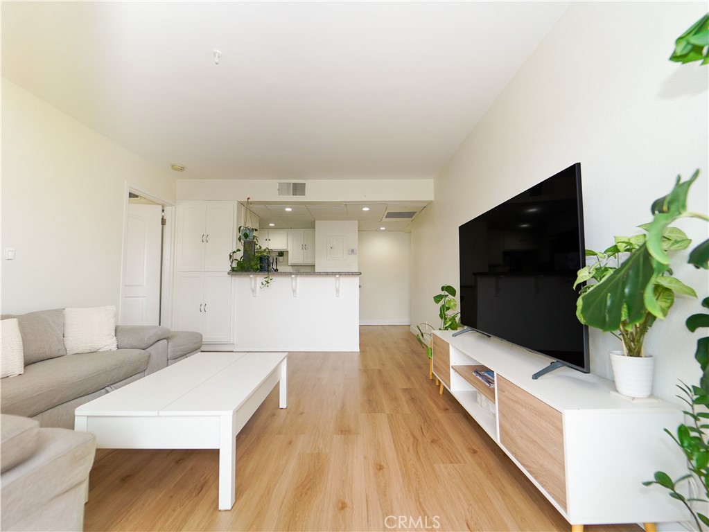 Top-floor condo in the heart of Long Beach! This bright and inviting 2-bedroom, 2-bath unit features fresh paint and warm luxury vinyl plank flooring throughout, complemented by a brand-new A/C system for year-round comfort. The open-concept living area flows seamlessly into the kitchen and leads to a private balcony with views of Downtown Long Beach. The spacious primary suite includes an en-suite bathroom, while the second bedroom offers generous space and a similar layout. Other amenities include:1 assigned parking space, 1 additional transferrable parking space with $75 monthly fee, and pool.