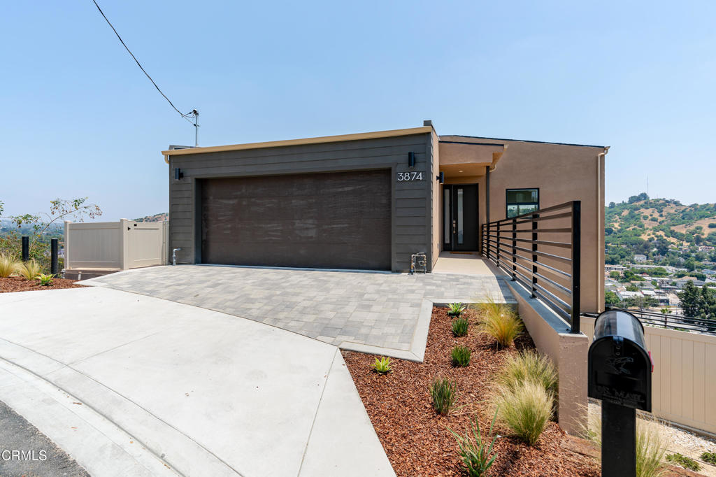 Welcome to this stunning new construction home in the hills of Mount Washington -- where refined design meets panoramic beauty. With 1,952 square feet, 3 bedrooms, and 2.5 baths, this home is thoughtfully crafted to maximize space, comfort, and natural light at every turn. On the main living level, an expansive patio opens up to capture incredible views of Downtown LA and the mountains beyond, while large windows throughout the home flood the space with warm, energizing light all day long. The open-concept kitchen is both stylish and functional, featuring an LG refrigerator, Frigidaire gas stove and dishwasher, generous counter space, and ample seating for effortless hosting. Downstairs, the private primary suite offers a peaceful escape, complete with a spa-inspired bathroom, dual sinks, and a secluded water closet. The lower level also features two additional bedrooms and a dedicated laundry room. With its natural breeze, soaring views, and bright, airy interiors, this home captures the essence of modern California living in one of LA's most sought-after hillside neighborhoods.