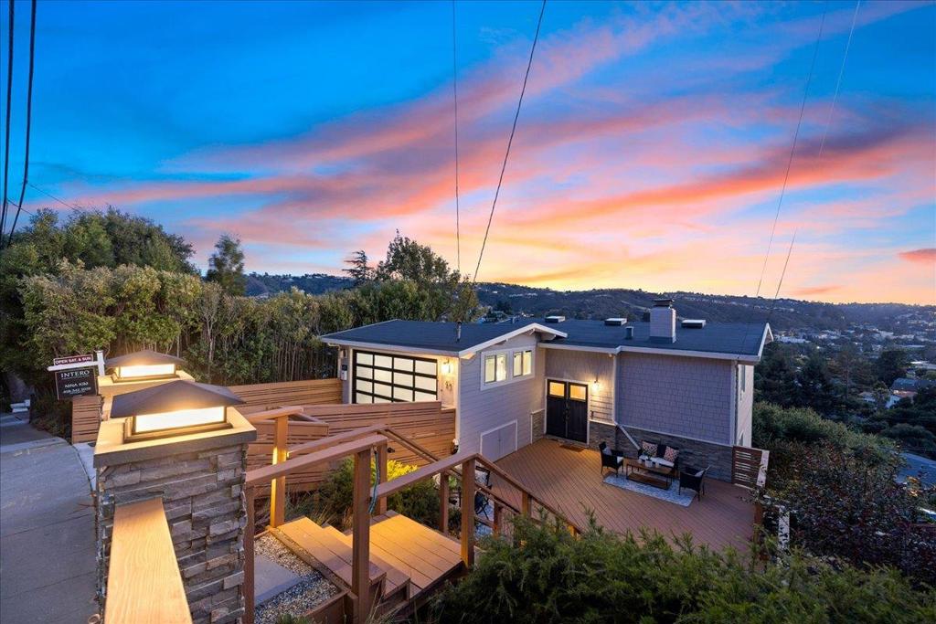 Experience Impeccable Designer Living with breathtaking Panoramic Foothill & Canyon Views! A stunningly remodeled home in coveted San Carlos Hills delivers Captivating Views Day & Night, not to mention the beautiful Sunset every evening! Walking Distance to all 3 Top Rated Schools, this property pairs Luxury, Comfort, and Sophistication in a Spectacular Natural Setting. Vaulted ceiling, Remote-Controlled Skylights, Refinished Hardwood Floors throughout, Fireplace wall is Pre-wired for Media Perfect for cozy nights in. A Spacious Front Deck invites Outdoor Living & Entertaining against a dramatic Canyon Backdrop. 2-Car Garage has been thoughtfully Converted into a versatile Bonus room/Playroom with Wide-plank Hardwood, Side Windows, and Motorized Shades and Easily Reversible if needed. Chef-Inspired Kitchen features dramatic Quartzite countertops, JennAir appliances, a Wine Cooler, and a sleek Pot Filler above the gas range ready for your next dinner party. All Bathrooms have been Elegantly Remodeled with High-end Finishes, Frameless Track-Hung Sliding Glass Doors and designer details. Located just one block from the 4.4-acre Arguello Park with a Playground, Picnic areas and Lighted Tennis Courts, and a mile from the vibrant downtown San Carlos.