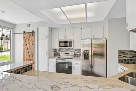 Photo of 5722 E Stillwater Ave, Orange, CA 92869 (MLS # OC26225823)