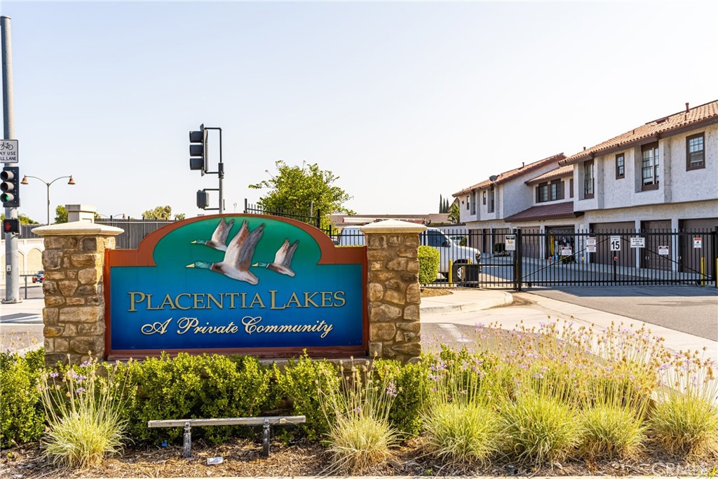 Welcome to this beautifully upgraded 2 bedrooms/ 2.5 baths 2 story townhome nestled ina sought after a gated resort style community of Placentia Lakes offering resort style amenities such as pool, spa, tennis courts, club house sauna. Enjoy the comfort of modern living with features such as recess lighting, Soaring high celling, wood floors, new paint, new HVAC unit, crown molding, built-in gas range, dishwasher & microwave.re. quartz kitchen counter, stainless steel sink, a walk-in pantry. Dining area off kitchen. Step down living room with gas burning fire place, sliding door leading to a back patio over looking lust greenery & water stream. Patio has a laundry room with a storage cabinet & water heater. half a bath is located on first floor. Upstairs offers Master bedroom with a high ceiling, recessed lights, attached bath, 2 closets , one is walking closet & balcony over looking community pool & water stream. Upstairs 2nd bedroom has a mirror closet doors and a hall way full upgraded bath. More photos are coming. Offer 1 car shared garage and ample parking in the community.