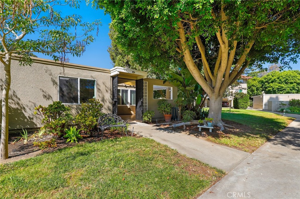 Beautiful newly painted and professionally cleaned Cordoba model in 55 plus Laguna Woods Village community, corner end unit NO ONE ABOVE, NO ONE BELOW, with enclosed patio, double French entry door in to a large living room. Extended kitchen breakfast nook area with added window with plantation shutters and walk in pantry, added sliding door to the patio, Large enclosed atrium with skylight, (5 skylight throughout the house), vinyl engineered wood planks throughout the house, two large size bedrooms with mirror wardrobes, tiles in the bathrooms, central air conditioning and heating, stacked washer and dryer, this unit is surrounded by beautiful greenbelt, large grass area and mature trees, carport is space #8, very close to unit, plenty storage in carport, bus stop is close by. Laguna Wood is a resort living style complex, is one of the best senior community in Orange County, with 7 club houses, swimming pools, tennis courts, access to the golf courses, library and countless social activities.