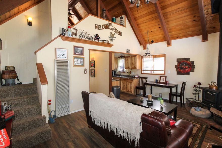 REDUCED 25K... This updated chalet is situated near the national forest in a quiet area of Sugarloaf. It features a modern kitchen equipped with all essential appliances, tongue and groove ceilings, an efficient wood-burning stove, vaulted ceilings, and dual pane windows. The cabin is turnkey and offers a perfect retreat in the mountains for a relaxing escape. Currently, the property is being utilized as a full-time rental with a strong rental history.