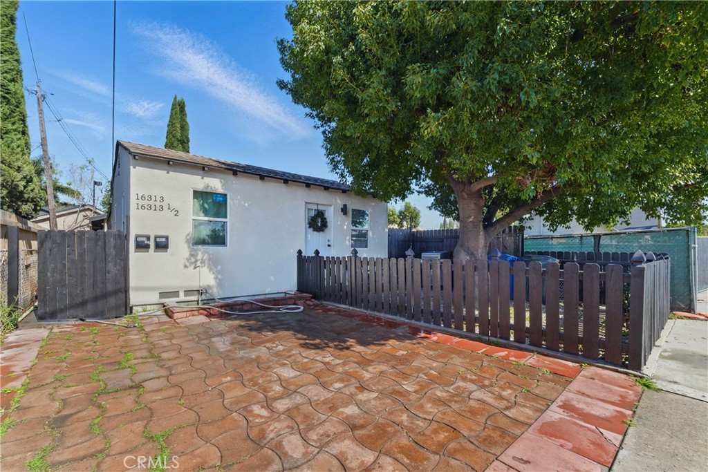 Prime location, 2 Unit property in city of Paramount. Two bedroom one bathroom front unit and one detached studio in back. Live in one and rent the other or put your own tenants. Both units fully remodeled.