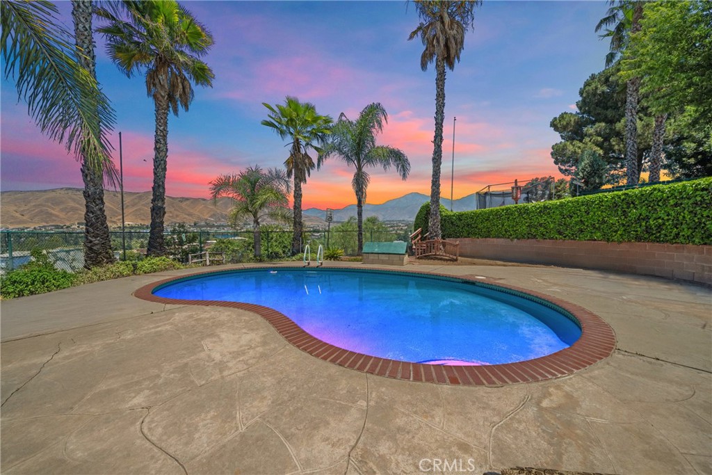 Perfect for Multi-Generational Living, Remodeled & Move-In Ready! Welcome to 33708 Washington Drive, Yucaipa — a unique and beautifully remodeled property designed for multi-family or multi-generational living. This home has been thoughtfully reconfigured into two fully functional living spaces, each with its own kitchen, living area, and private entry points, making it ideal for extended families, in-laws, or even rental potential. With recent upgrades throughout, this home combines style, functionality, and efficiency. Enjoy the benefits of paid-in-full solar, split AC and furnace systems for customized climate control, an attic fan, and a whole-house water filtration system. The recirculating water pump on the water heater ensures instant hot water, and the split shut-off valve adds convenience and peace of mind.Step outside to your resort-style backyard — complete with a sparkling pool, separate spa/jacuzzi, sunshade retreat, and deck, all designed for exceptional privacy and amazing views. It's the perfect space to unwind, entertain, and enjoy California living in peace. Inside, you'll also find two fireplaces, a game room, and thoughtful details that enhance both comfort and versatility. Whether you're looking to live together while maintaining privacy or want a flexible layout with income potential, this home offers versatility and modern comfort that’s hard to find.Don’t miss this opportunity to own a truly unique property in a peaceful Yucaipa neighborhood!