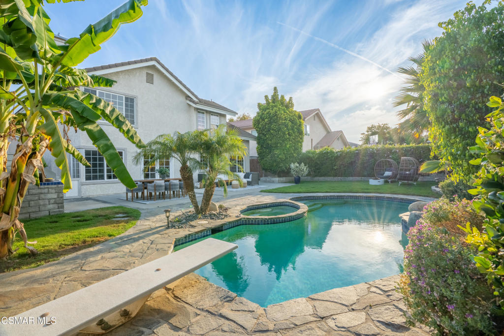 Spectacular Camarillo pool home with privacy! Highly desirable natural light filled open floor plan with 3 bedrooms & 2.5 baths. Bright and open living room flows seamlessly into the dining room. Upgraded gourmet kitchen is ideal spot to host friends and family, beautiful cabinets, ample storage, granite countertops, tile backsplash, stainless steel appliances, and breakfast area. Adjoining spacious family room, fireplace, and French doors that open to resort style yard. Private primary suite, closet and storage, luxurious vanity with stone countertops, and upgraded shower stall. Immaculate backyard with sparkling pool, lush landscaping, and built-in BBQ center. New interior paint. 2 car garage! Wonderful curb appeal. Near schools, parks, downtown, shopping, and dining. A special offering, must see!